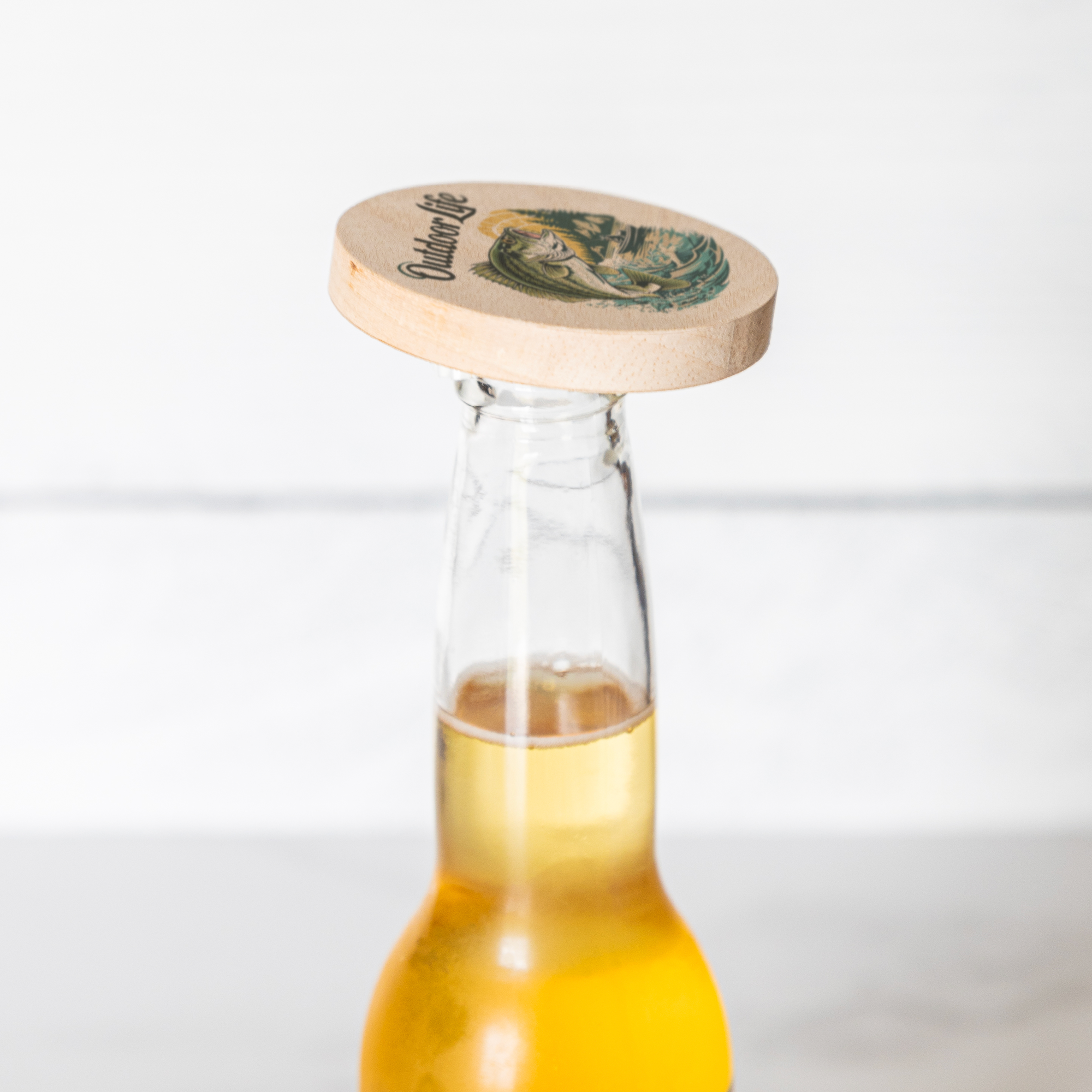 Bass_Fishing_Wooden_Bottle_Opener_Bottle_Use_Mockup.png